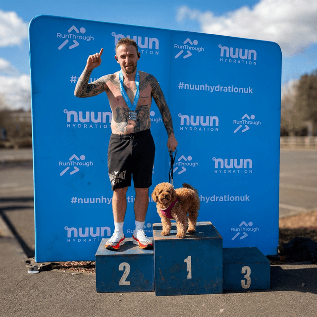 Denny and Lola the Cavapoo on podium