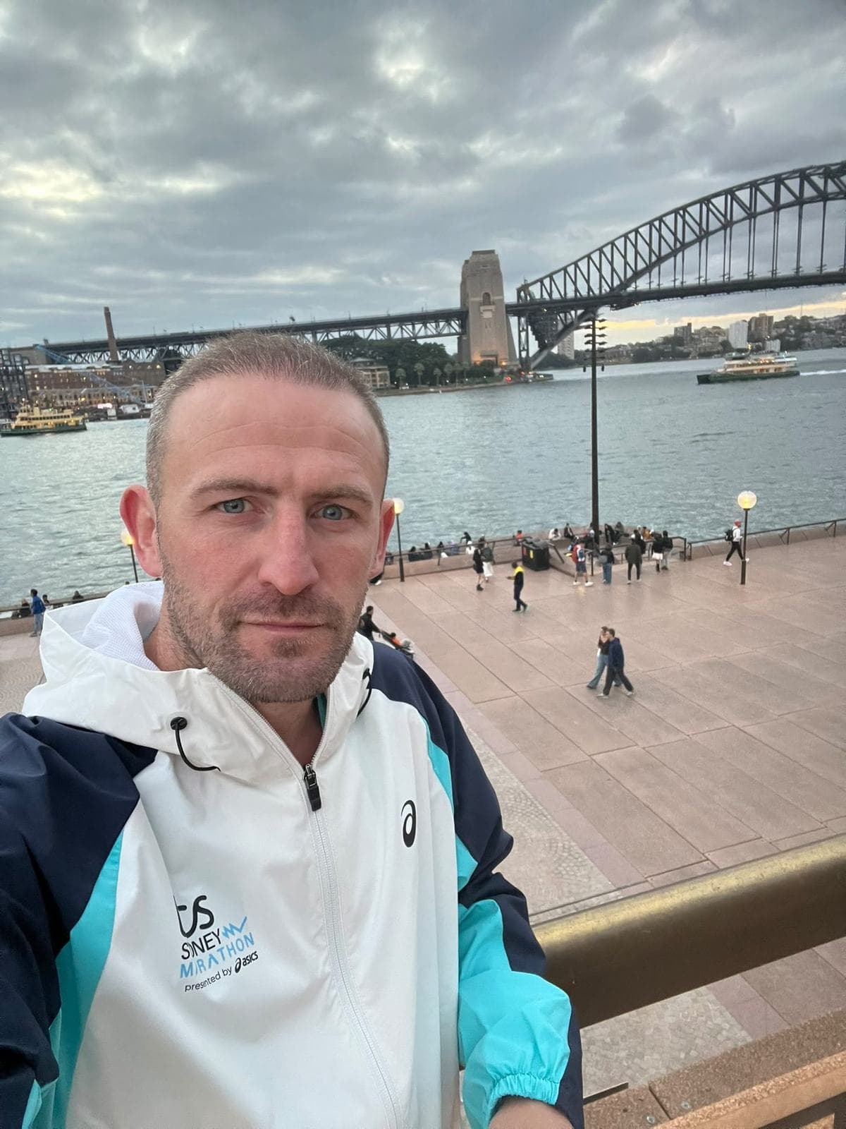 Denny at Circular Quay with the Sydney Opera House and Harbour Bridge behind